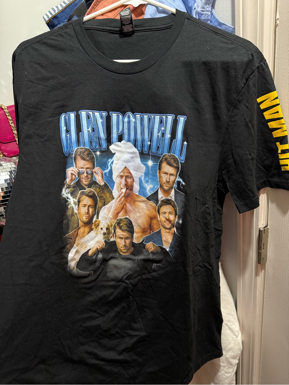 Glen Powell Black Graphic Tee - Hitman movie promotional gear.